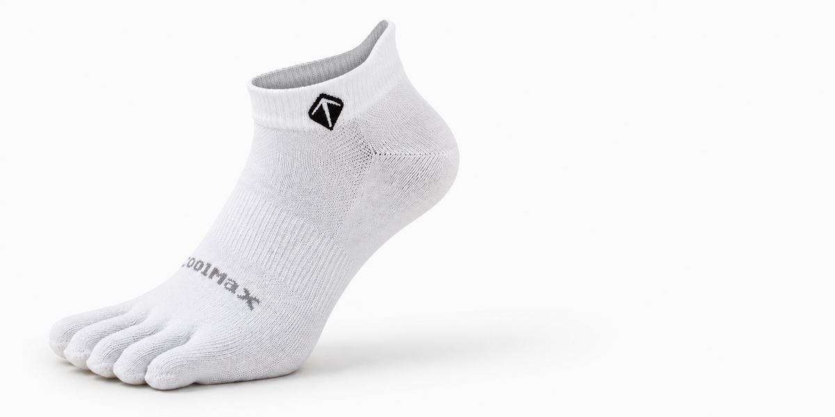 Close-up of five separated toe pockets on a white sock